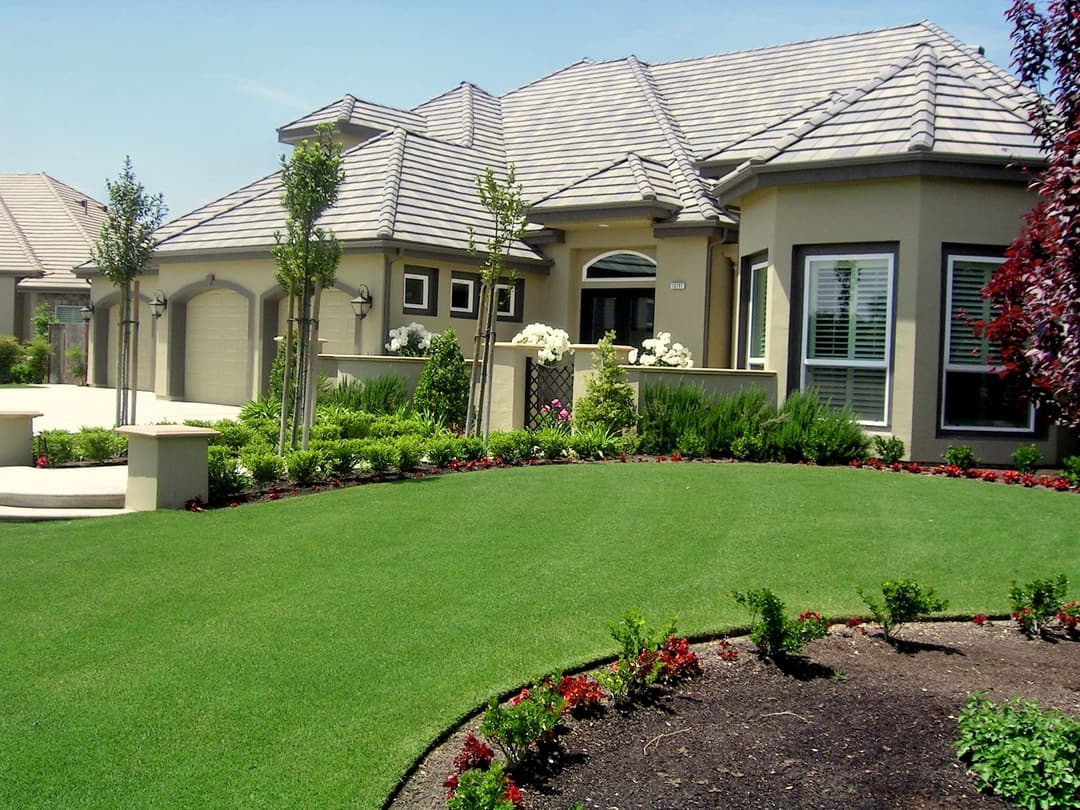 Elegant suburban home with manicured lawn and vibrant landscaping. Ideal for family living.